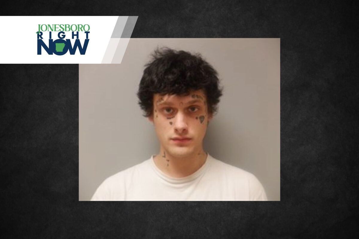Mugshot-style photo of a young man with facial tattoos against a gray background, with a Jonesboro Right Now banner in the top-left corner.