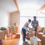 couple in room surrounded by boxes
