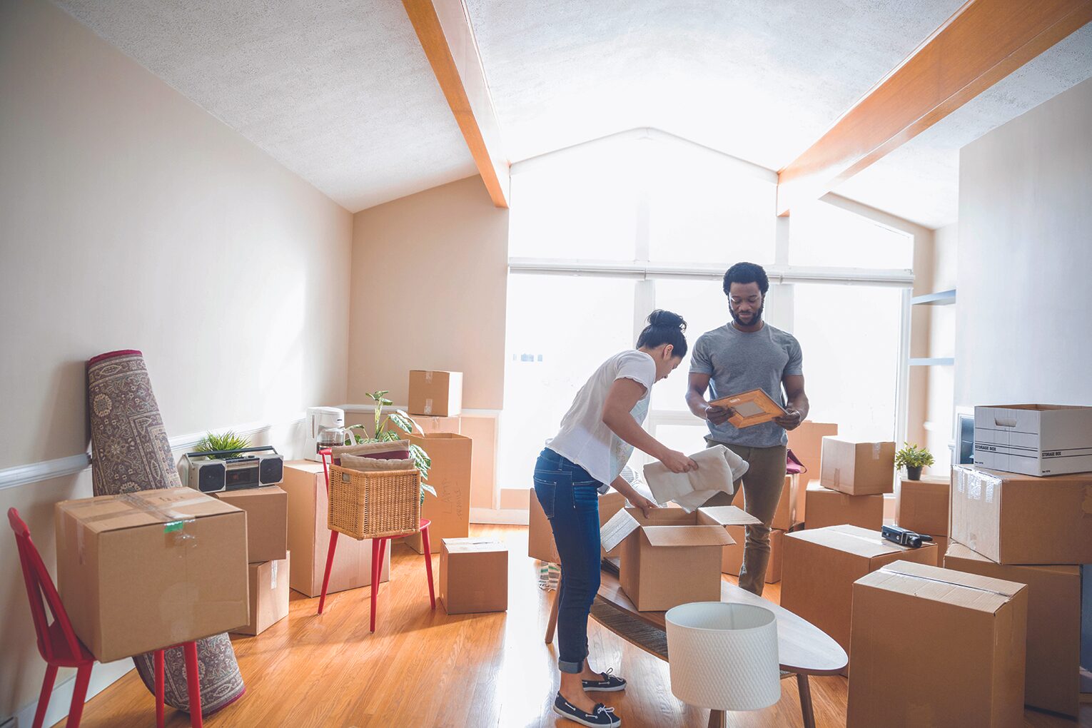 couple in room surrounded by boxes