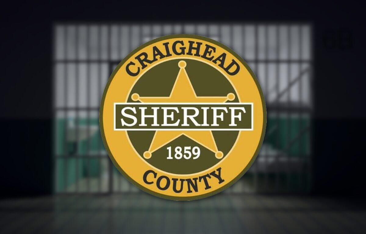 Circular gold Craighead County sheriff badge with a five-point star, a black 'SHERIFF' banner, and the year 1859.