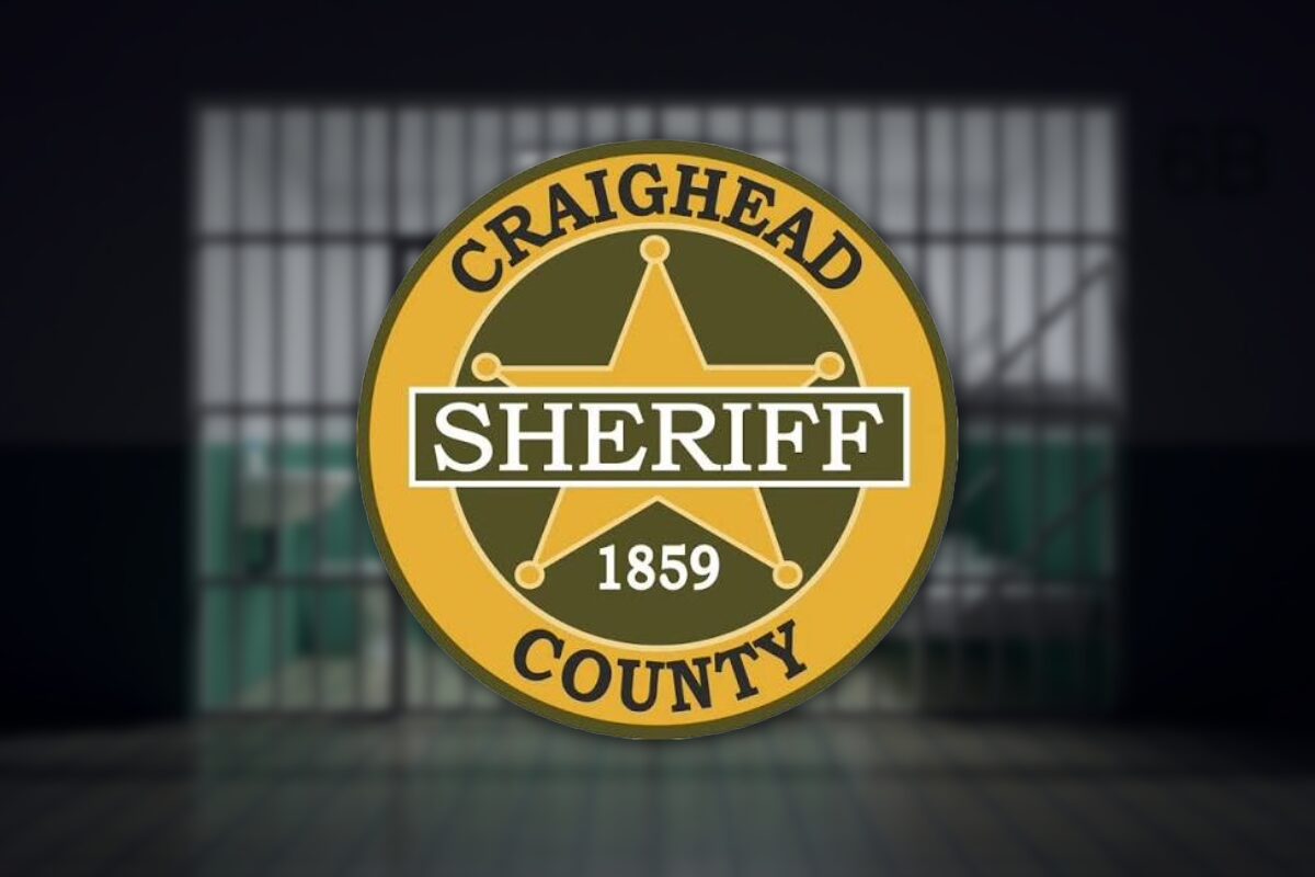 Circular gold Craighead County sheriff badge with a five-point star, a black 'SHERIFF' banner, and the year 1859.