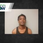 Mugshot-style photo of a young man in a black tank top against a gray wall, with a Jonesboro Right Now logo in the upper left corner.