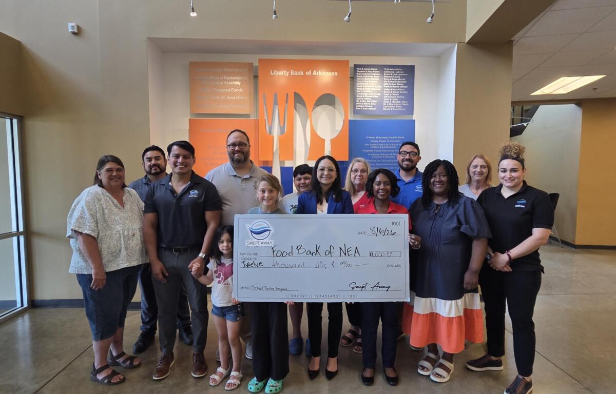 Swept Away Janitorial presents check to Food Bank of NEA